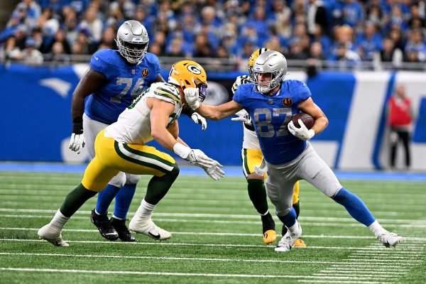 Nov 23, 2023; Detroit, Michigan, USA; Detroit Lions tight end Sam LaPorta (87) Detroit Lions runs upfield after catching a pass against the Green Bay Packers in the fourth quarter at Ford Field. Mandatory Credit: Lon Horwedel-USA TODAY Sports