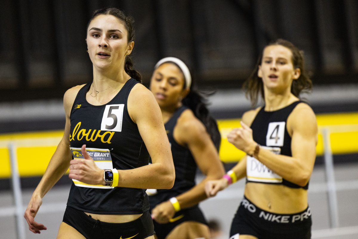 Iowa’s Chloe Larsen runs during the Jimmy Grant Alumni Invitational at the Hawkeye Indoor Track Facility on Saturday, Dec. 9, 2023. The Hawkeyes hosted Western Illinois and Wisconsin, competing in events including the pentathlon, weight throwing, field events, and various running events at the indoor track.