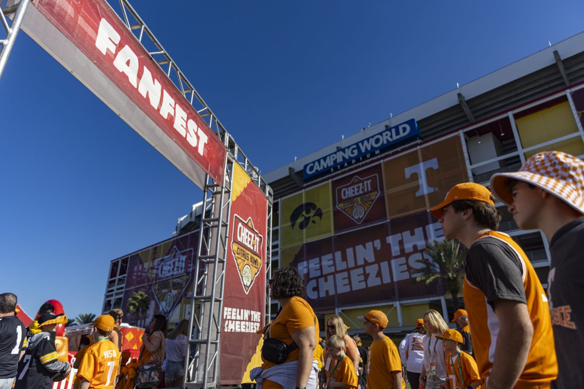 Fans walk into the 2024 Cheez-It Citrus Bowl FanFest at Tinker Field next to Camping World Stadium before the matchup between No. 17 Iowa and No. 21 Tennessee in Orlando, Fla., on Monday, Jan. 1, 2024.