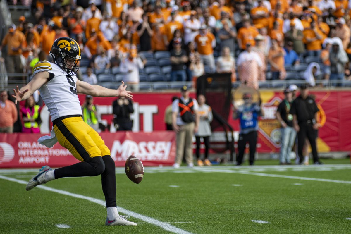 Iowa punter Tory Taylor punts the ball during the 2024 Cheez-It Citrus Bowl between No. 17 Iowa and No. 21 Tennessee at Camping World Stadium in Orlando, Fla., on Monday, Jan. 1, 2024. Taylor set an NCAA record with 12.55 left in the first quarter. Taylor set the record for single-season punting yards with 4,479 punting yards. The Volunteers defeated the Hawkeyes, 35-0. 