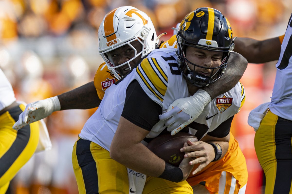 Tennessee defensive lineman Tyre West sacks Iowa quarterback Deacon Hill during the 2024 Cheez-It Citrus Bowl between No. 17 Iowa and No. 21 Tennessee at Camping World Stadium in Orlando, Fla., on Monday, Jan. 1, 2024. Tennessee sacked Iowa five times. The Volunteers defeated the Hawkeyes, 35-0. 
