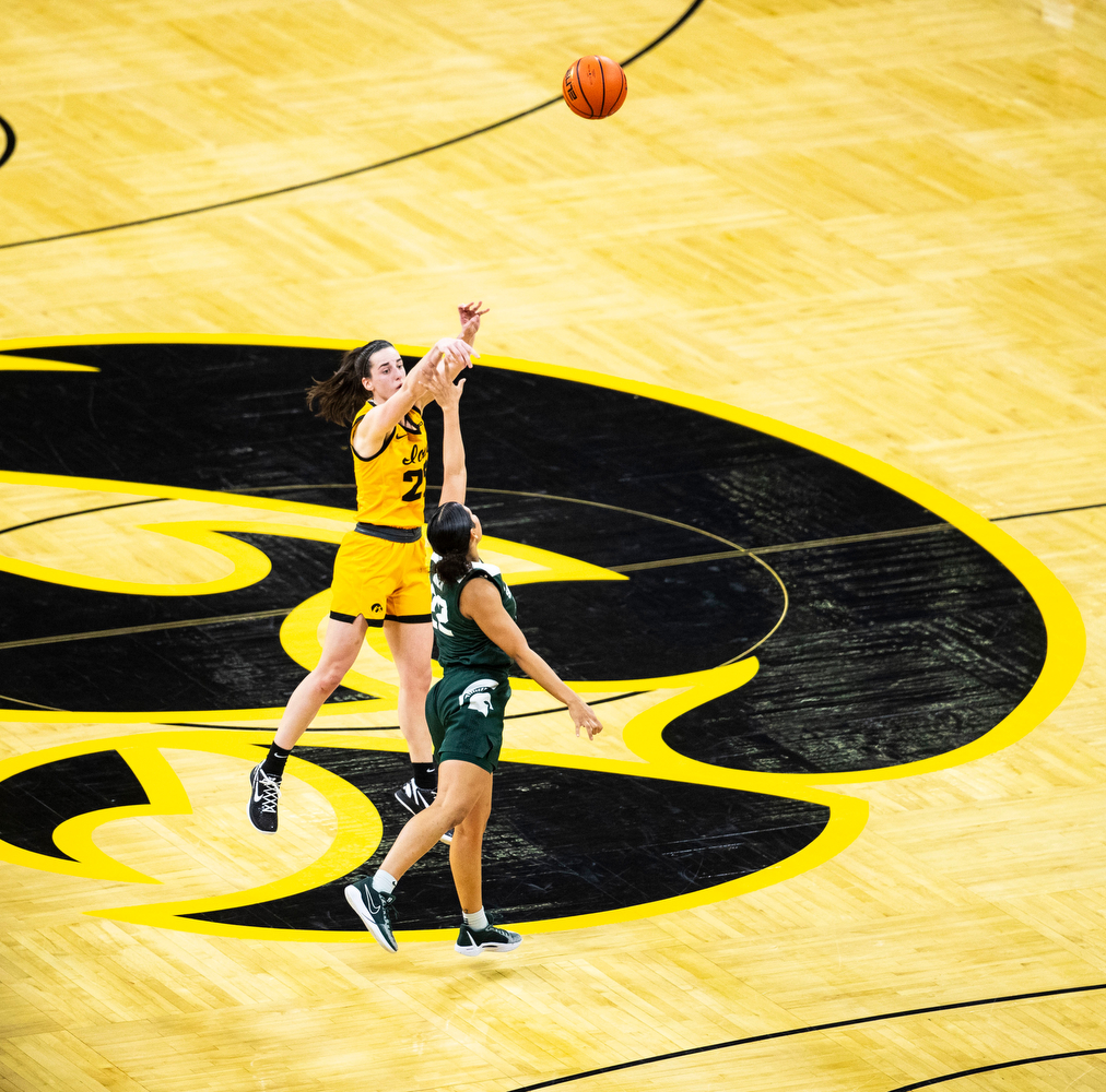 Iowa guard Caitlin Clark shoots a game ending three-pointer during a women’s basketball game between No. 4 Iowa and Michigan State in a sold-out Carver-Hawkeye Arena on Tuesday, Jan. 2, 2023. Clark had 40 points and five assists. The Hawkeyes defeated the Spartans, 76-73.