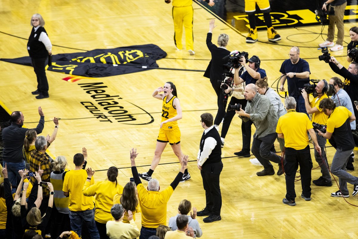 Iowa guard Caitlin Clark hypes up the crowd after scoring a game-ending three-pointer at a women’s basketball game between No. 4 Iowa and Michigan State in a sold-out Carver-Hawkeye Arena on Tuesday, Jan. 2, 2023. The Hawkeyes defeated the Spartans, 76-73. 