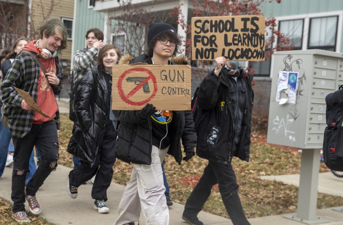 Students+walk+toward+downtown+during+a+walkout+for+Iowa+gun+reform+in+Iowa+City+on+Monday%2C+Jan.+8%2C+2024.+Following+the+first+mass+shooting+of+2024+at+Perry+High+School+on+Jan.+4%2C+high+school+students+across+Iowa+walked+out+of+school+in+solidarity+with+the+community+of+Perry.+Over+a+hundred+students+from+various+Iowa+City+schools+started+outside+of+Iowa+City+High+School+and+walked+downtown+to+the+Old+Capitol+on+the+Pentacrest.