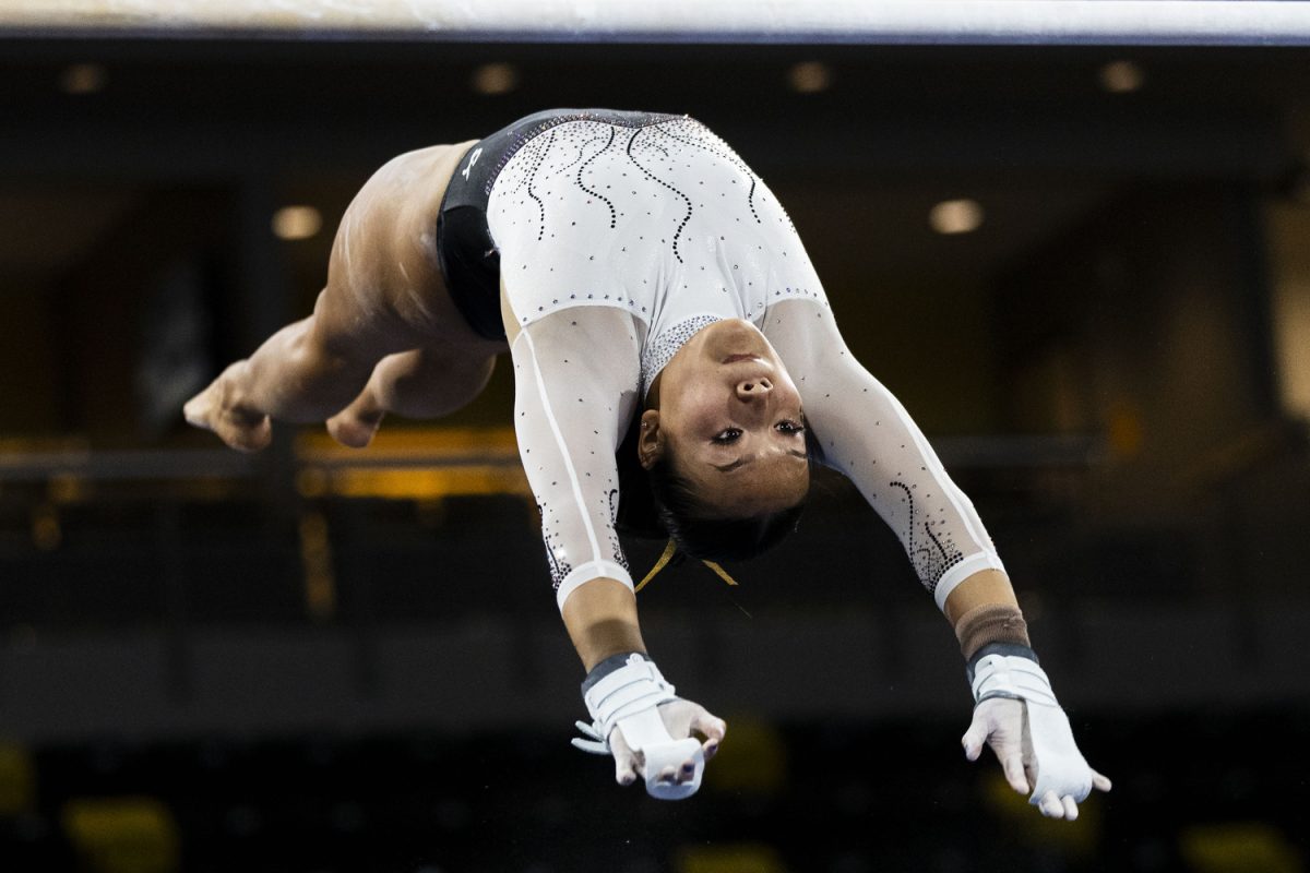 Iowa’s Adeline Kenlin performs on the bars during a gymnastics meet between No. 23 Iowa and No. 21 Washington at Xtream Arena in Coralville, Iowa, on Friday, Jan. 12, 2024. Kenlin scored 9.850 on the bars. In the fourth meeting between Iowa and Washington, the Hawkeyes defeated the Huskies, 196.400-196.250.