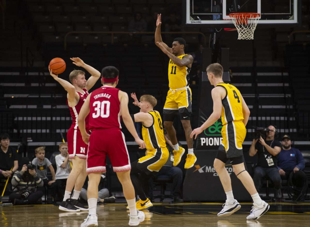 Iowa guard, Tony Perkins jumps to block a pass from Nebraska forward, Rienk Mast during a men’s basketball game between Iowa and Nebraska at Carver-Hawkeye Arena on Friday, Jan. 12, 2024. The Hawkeyes defeated the Cornhuskers, 94-76. 