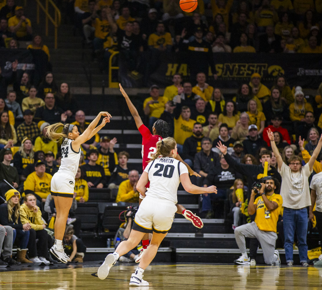 Iowa guard Gabbie Marshall shoots a three-pointer during a women’s basketball game between Iowa and Indiana at Carver-Hawkeye Arena on Saturday, Jan. 13, 2024. Marshall is 12-for-22 in 3-pointers in her last three games. The Hawkeyes defeated the Hoosiers, 84-57.
