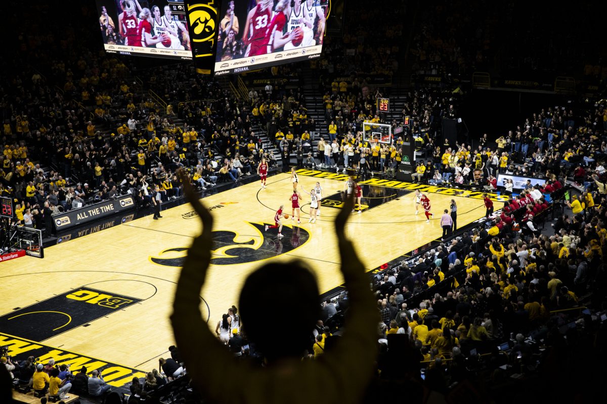 Iowa guard Caitlin Clark hypes up the crowd during a women’s basketball game between No. 3 Iowa and No. 14 Indiana at Carver-Hawkeye Arena in Iowa City on Saturday, Jan. 13, 2024. Clark shot 6-of-16 in 3-pointers, scoring 30 points for Iowa. The Hawkeyes defeated the Hoosiers, 84-57.