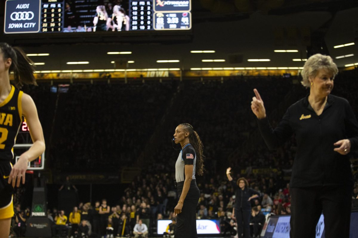 An official blows the whistle during a women’s basketball game between No. 2 Iowa and Wisconsin at Carver-Hawkeye Arena in Iowa City on Tuesday, Jan. 16, 2023. The Hawkeyes defeated the Badgers, 96-50.