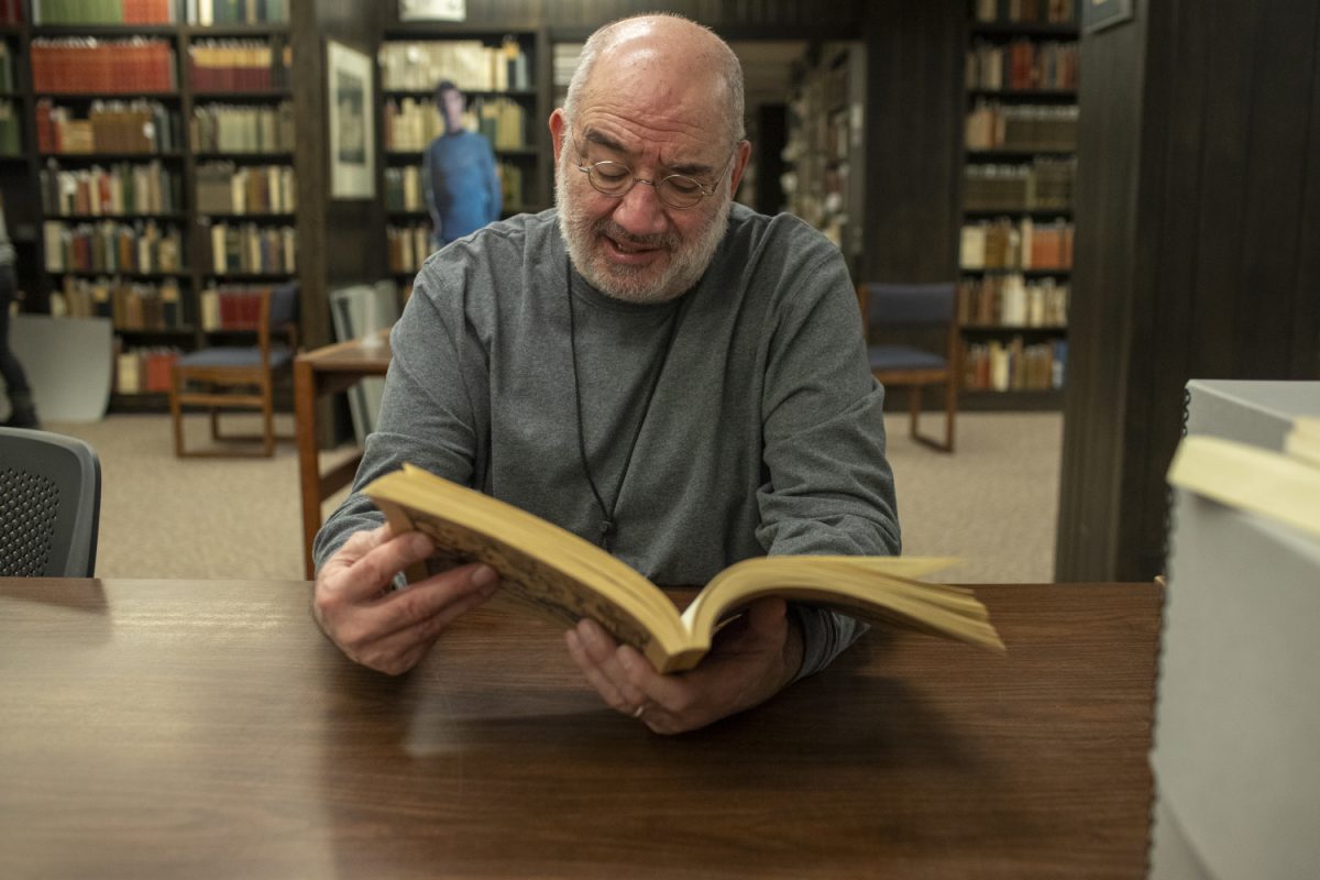 Curator Pete Balestrieri  points out notes in  fan fiction book Special Collections and Archives area in the Main Library in Iowa City on Friday, Jan. 19, 2024. 