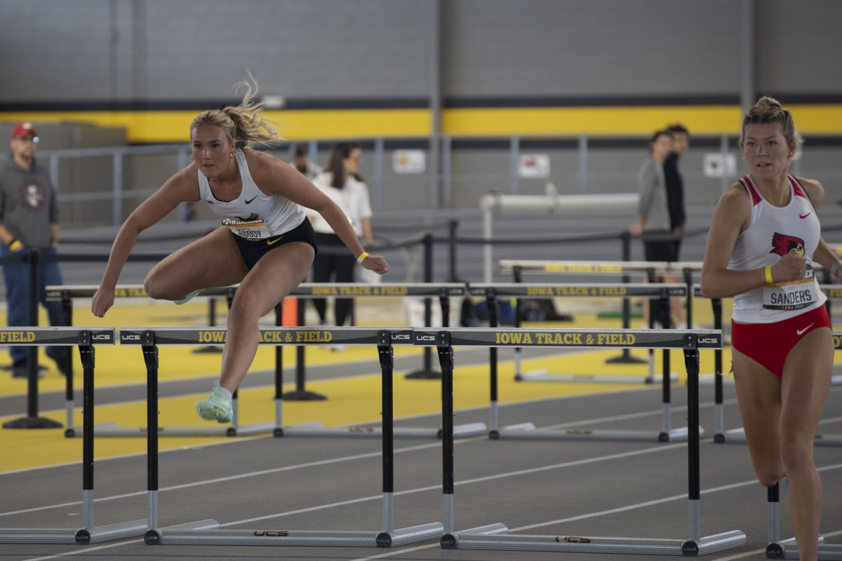 Iowa Isabelle Woody and Illinois State Kiley sanders compete in the women’s 60 meter hurdles during the first day of the Larry Wieczorek invitational at the Hawkeye Indoor Track Facility on Friday, Jan. 19, 2024. The Hawkeyes hosted a variety of schools including Illinois state and Wisconsin. Events at the invite included long jump, pole vault and various running events. 