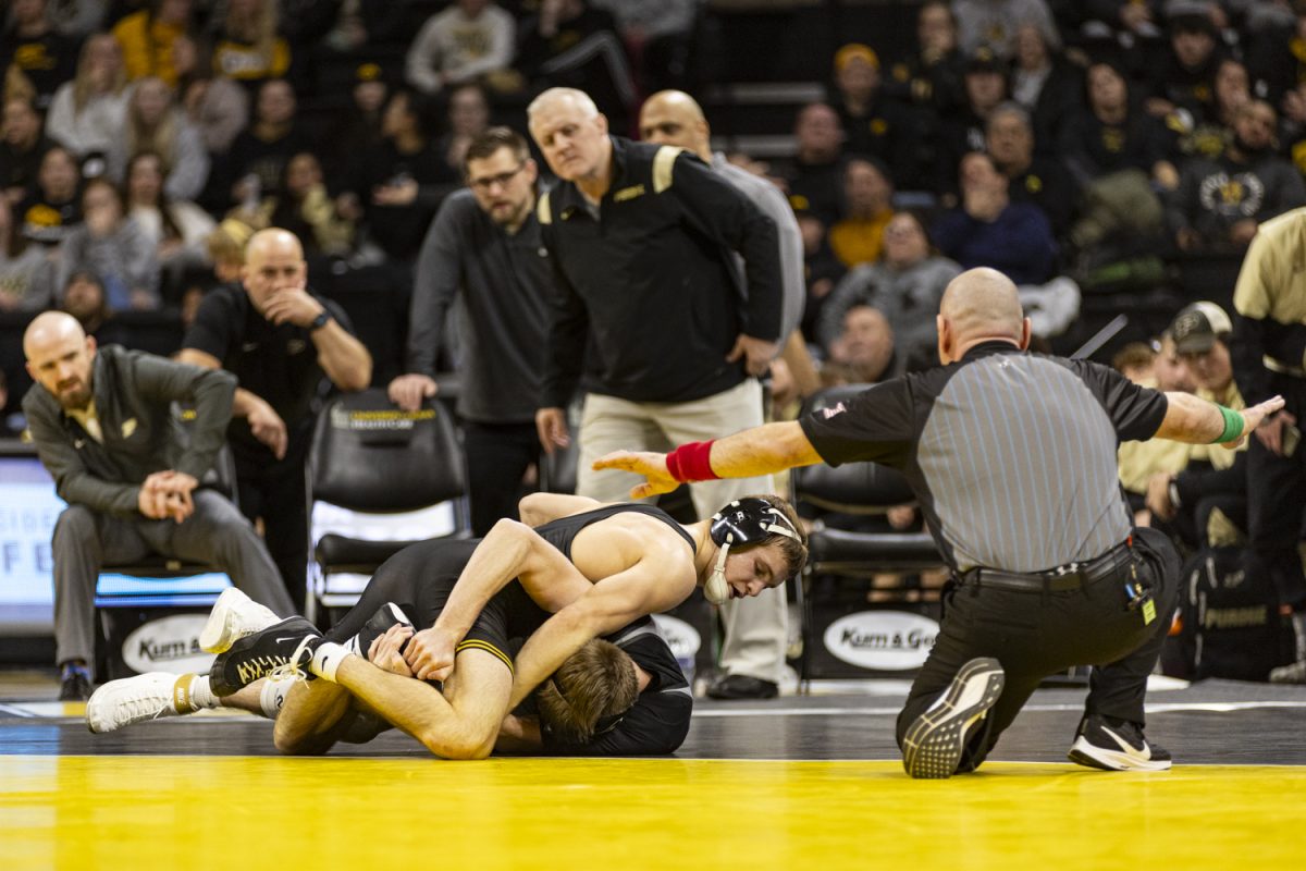 Iowa’s 133-pound Cullan Schriever wrestles Purdue’s Dustin Norris during a wrestling dual between No. 3 Iowa and Purdue in Carver-Hawkeye Arena on Friday, Jan. 19, 2024. The Hawkeyes defeated the Boilermakers, 34-6. 