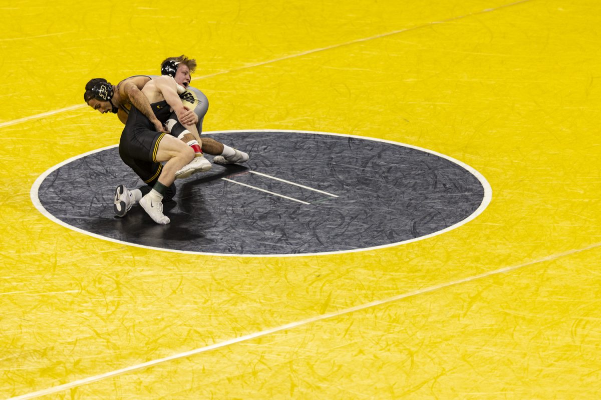 Iowa’s 149-pound Victor Voinovich III wrestles Purdue’s Marcus Polanco during a wrestling dual between No. 3 Iowa and Purdue in Carver-Hawkeye Arena on Friday, Jan. 19, 2024. The Hawkeyes defeated the Boilermakers, 34-6. 