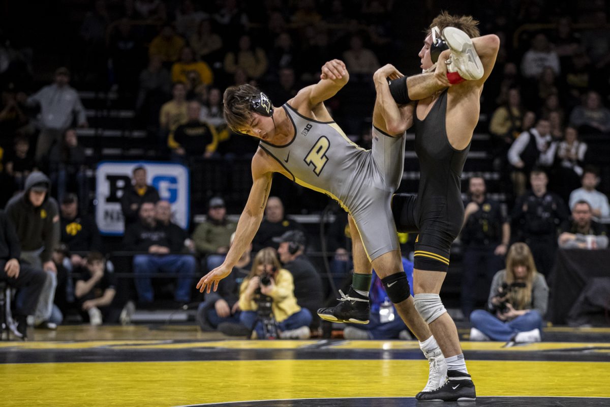 Iowa%E2%80%99s+No.+1+125-pound+Drake+Ayala+wrestles+Purdue%E2%80%99s+No.+2+Matt+Ramos+during+a+wrestling+dual+between+No.+3+Iowa+and+Purdue+at+Carver-Hawkeye+Area+on+Friday%2C+Jan.+19%2C+2024.+The+Hawkeyes+defeated+the+Boilermakers%2C+34-6.+Ramos+defeated+Ayala+by+decision%2C+4-1.