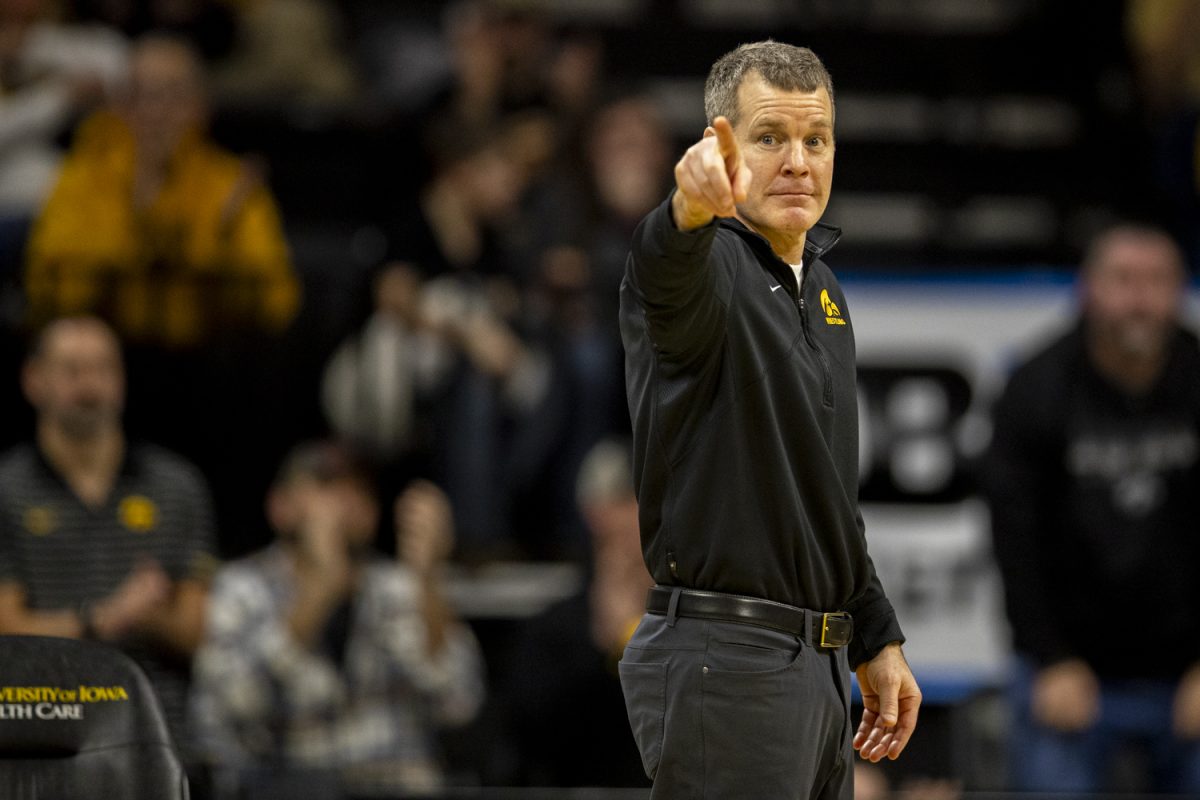 Iowa head coach Tom Brands points during a wrestling dual between No. 3 Iowa and Purdue at Carver-Hawkeye Area on Friday, Jan. 19, 2024. The Hawkeyes defeated the Boilermakers, 34-6.