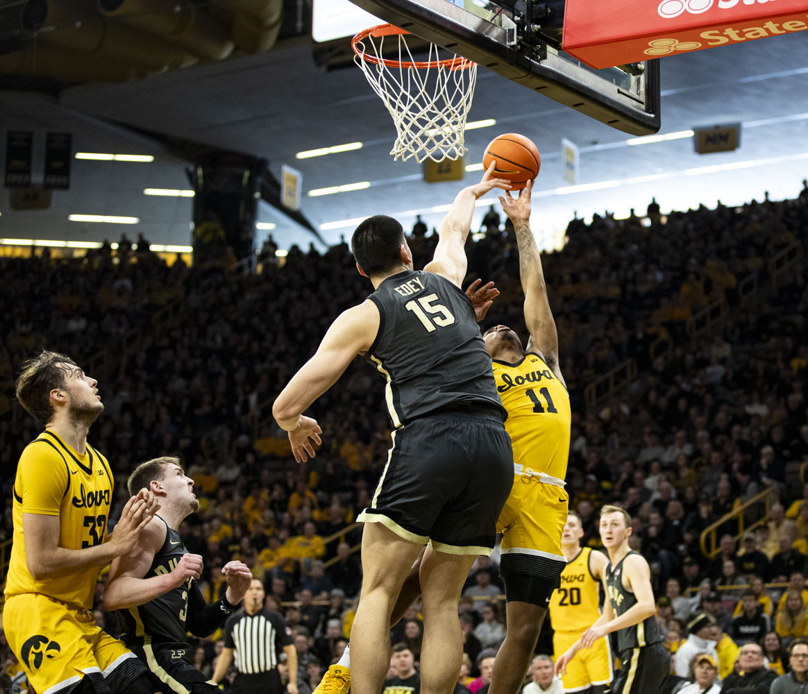 Purdue Center Zach Edey blocks Iowa Guard Tony Perkins during a men’s basketball game between Purdue and Iowa at Carver-Hawkeye Arena on Saturday, Jan. 20, 2024. Purdue leads at halftime, 47-34. (Carly Schrum/The Daily Iowan)