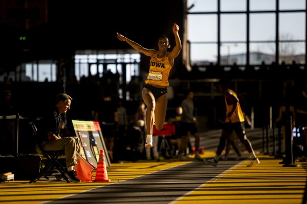 University of Iowa jumper Daniela Martine Wamokpego jumps in the triple jump during the second day of the Larry Wieczorek invitational at the Hawkeye Indoor Track Facility on Saturday, Jan. 20, 2024.  Wamokpego placed first overall in the triple jump premier.