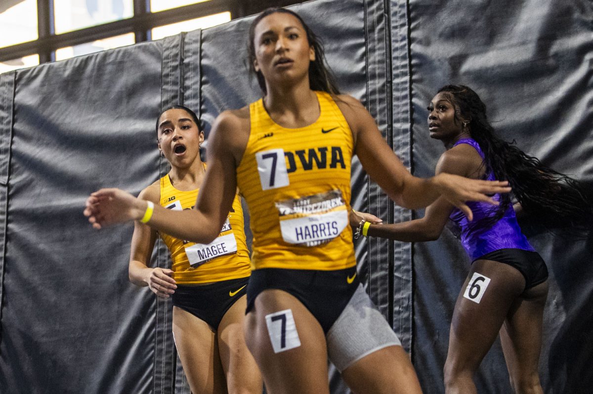 Iowa’s Paige Magee reacts to the scoreboard after competing in the 60-meter hurdle during the Larry Wieczorek Invitational at the Hawkeye Indoor Track Facility in Iowa City on Saturday, Jan. 20, 2024. Magee set a new personal and school record of 8.00.