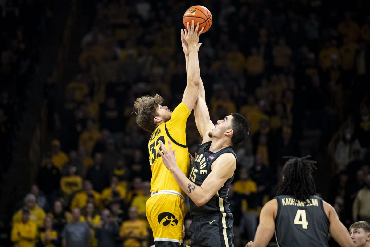 Iowa Forward Owen Freeman and Purdue Center Zach Edey jump for tip-off during a men’s basketball game between No. 2 Purdue and Iowa at Carver-Hawkeye Arena on Saturday, Jan. 20, 2024. The Boilermakers defeated the Hawkeyes, 84-70. Freeman had 6 points and 4 fouls during the game.