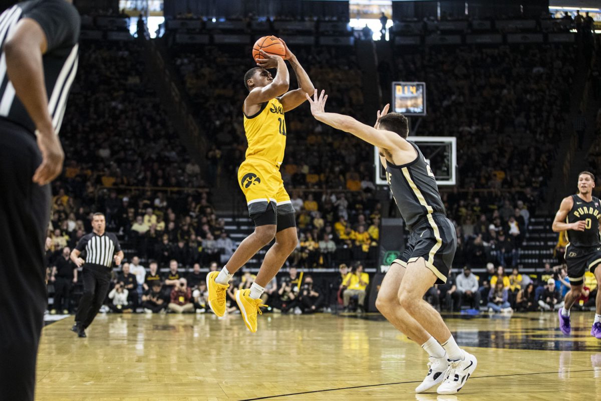 Iowa Guard Tony Perkins shots a last second three during a men’s basketball game between No. 2 Purdue and Iowa at Carver-Hawkeye Arena on Saturday, Jan. 20, 2024. The Boilermakers defeated the Hawkeyes, 84-70. Perkins had 24 points during the game.