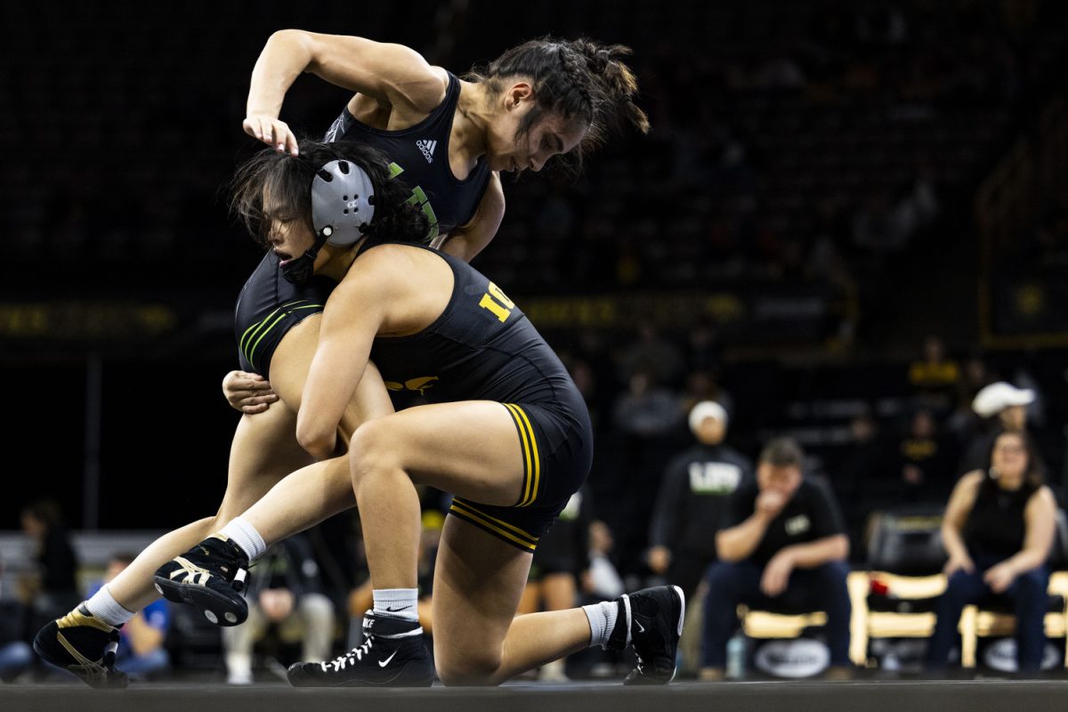 Iowa’s NCAA No. 2 101-pound Sterling Dias takes down Life’s NAIA No. 7 101-pound Devyn Gomez during the Iowa Duals between NCAA-ranked No. 1 Iowa women’s wrestling, NAIA-ranked No. 1 Life University, and Missouri Valley at Carver-Hawkeye Arena in Iowa City on Sunday, Jan. 21, 2024. Dias defeated Gomez by tech fall, 10-0. The Hawkeyes defeated the Big Reds, 42-0, and the Running Eagles, 35-6.