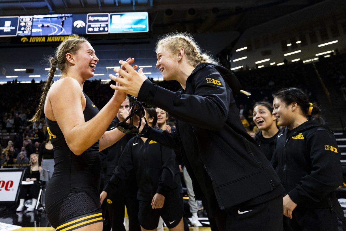 Iowa’s NCAA No. 1 170-pound Kylie Welker and Iowa’s NCAA No. 4 143-pound Ella Schmit celebrate during the Iowa Duals between NCAA-ranked No. 1 Iowa women’s wrestling, NAIA-ranked No. 1 Life University, and Missouri Valley at Carver-Hawkeye Arena in Iowa City on Sunday, Jan. 21, 2024. The Hawkeyes defeated the Big Reds, 42-0, and the Running Eagles, 35-6.