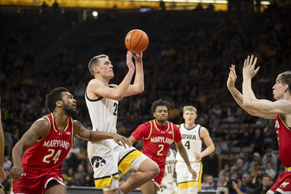 Iowa forward Payton Sandfort shoots the ball during a mens basketball game between the Iowa Hawkeyes and the Maryland Terrapins at Carver-Hawkeye Arena on Wednesday, Jan. 24, 2024. The Terrapins defeated the Hawkeyes, 69-67.