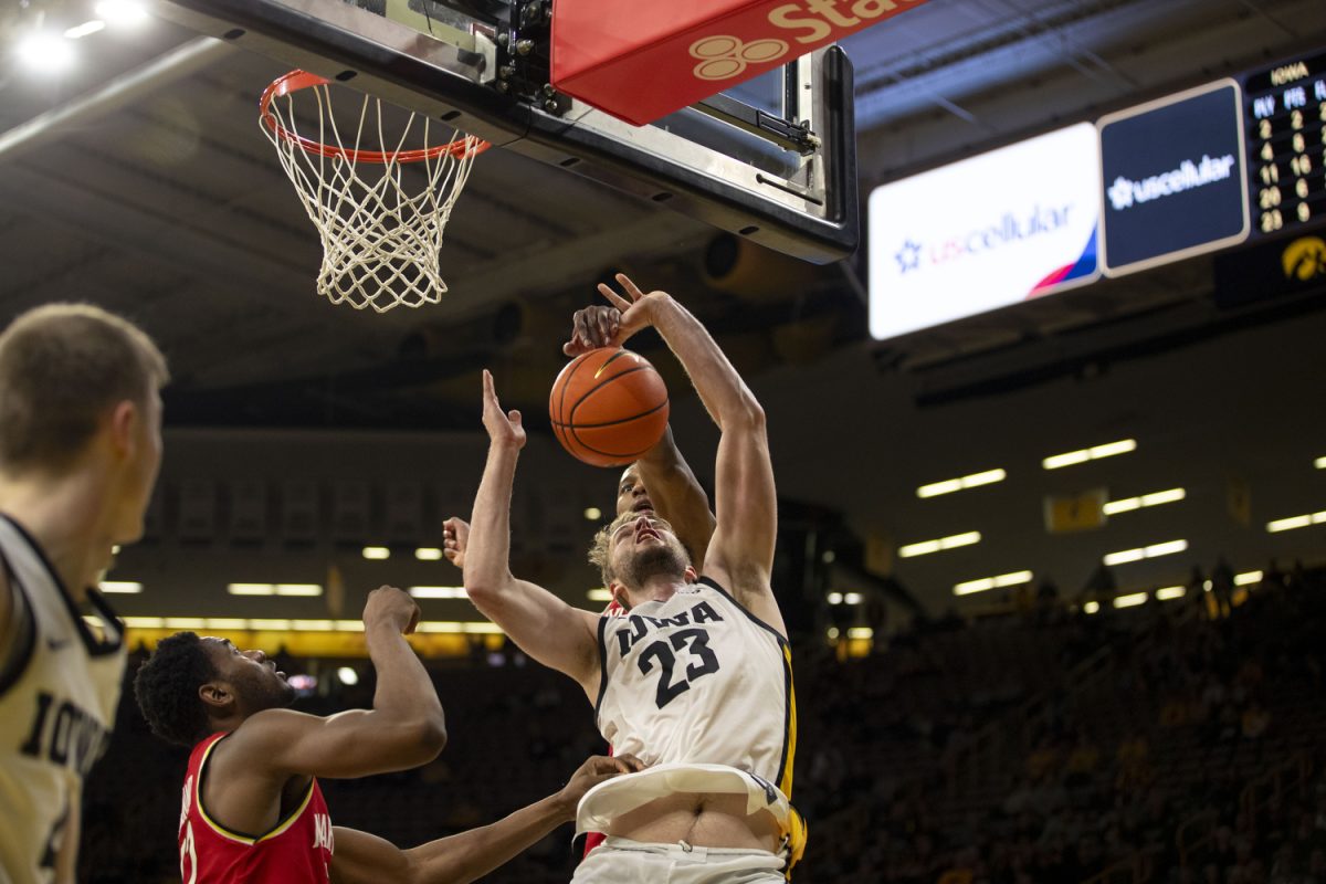 Iowa guard Ben Krikke gets blocked during a mens basketball game between the Iowa Hawkeyes and the Maryland Terrapins at Carver-Hawkeye Arena on Wednesday, Jan. 24, 2024. The Terrapins defeated the Hawkeyes, 69-67.
