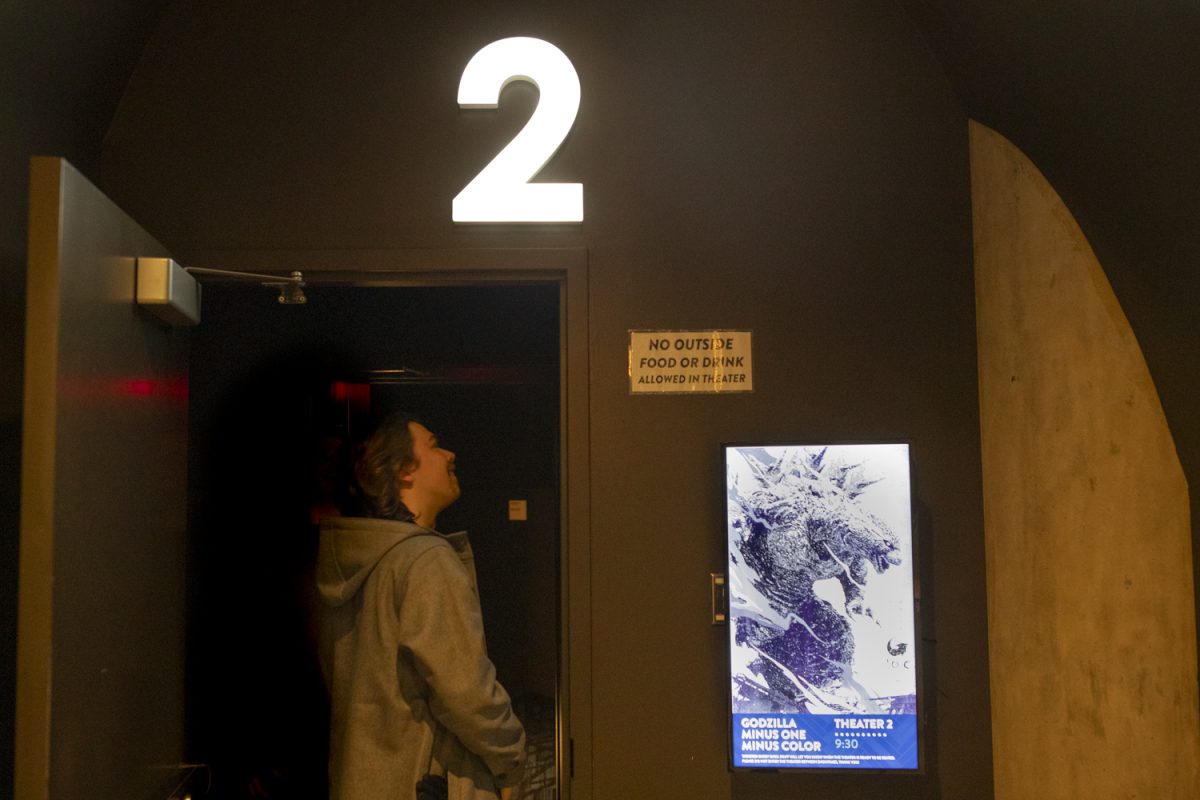 A patron enters a black-and-white showing of 2023 film “Godzilla Minus One” at the Chauncey FilmScene in Iowa City on Friday, Jan. 26, 2024. This special showing runs until Thursday, Feb. 1.