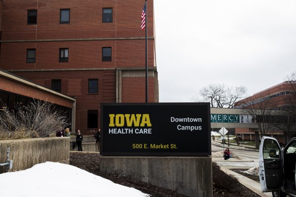The new Iowa Health Care sign is seen during a Mercy signage changing at the University of Iowa Health Care Downtown Campus building in Iowa City on Wednesday, Jan. 31. (Cody Blissett/The Daily Iowan)