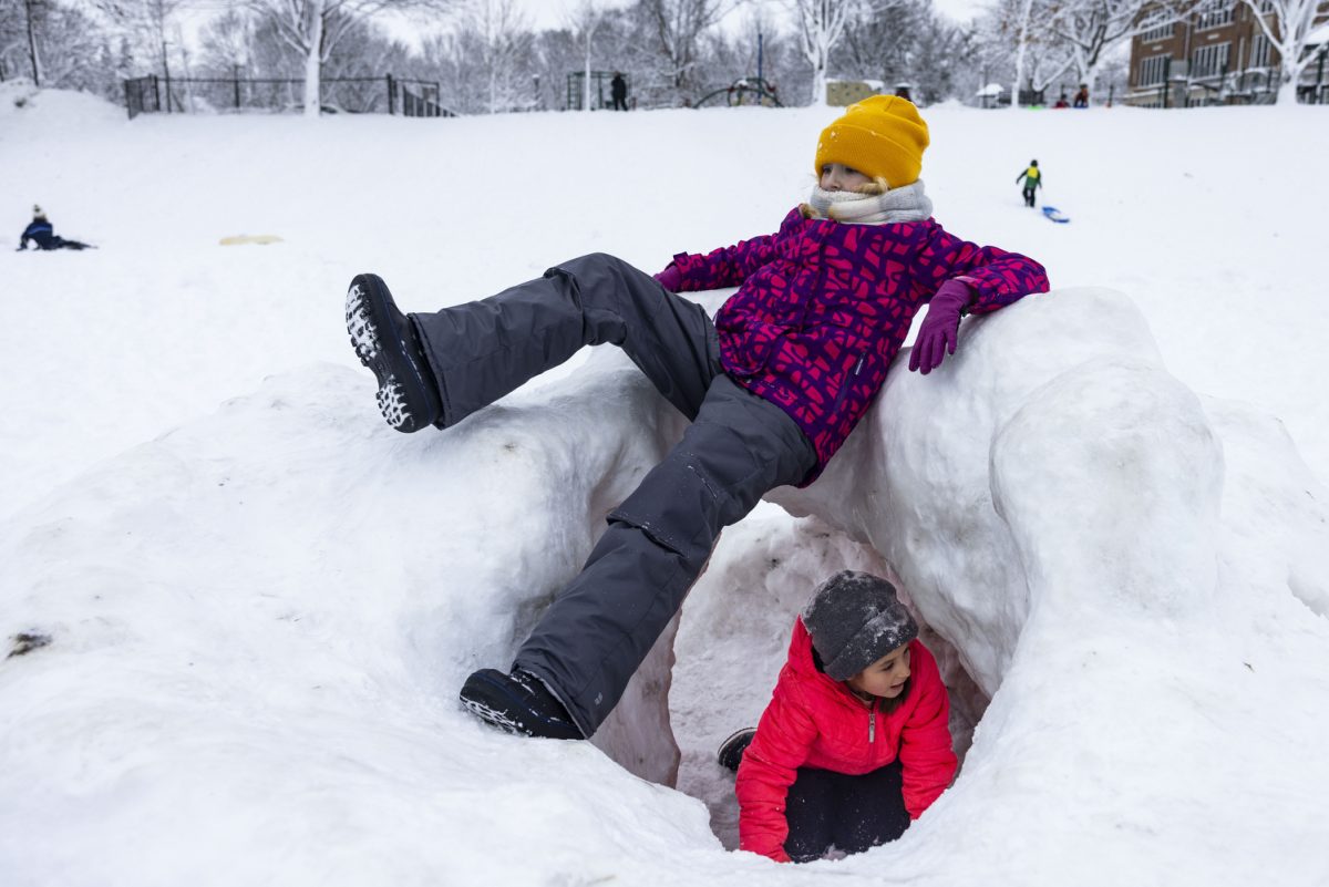 Ivy Schaefer, 9, and Maddy MacKenzie, 8, climb on a snow fort at Longfellow Elementary School in Iowa City on Thursday, January 11, 2024. A snowstorm swept across Iowa on Tuesday, Jan. 9 and Iowa City reported 15 inches of snow as of 8 p.m. that day.