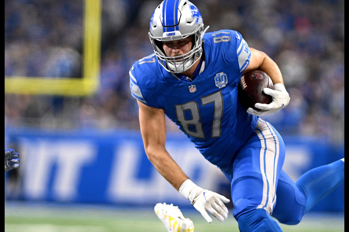 Jan 14, 2024; Detroit, Michigan, USA; Detroit Lions tight end Sam LaPorta (87) runs after a catch during the first half of a 2024 NFC wild card game against the Los Angeles Rams at Ford Field. Mandatory Credit: Lon Horwedel-USA TODAY Sports