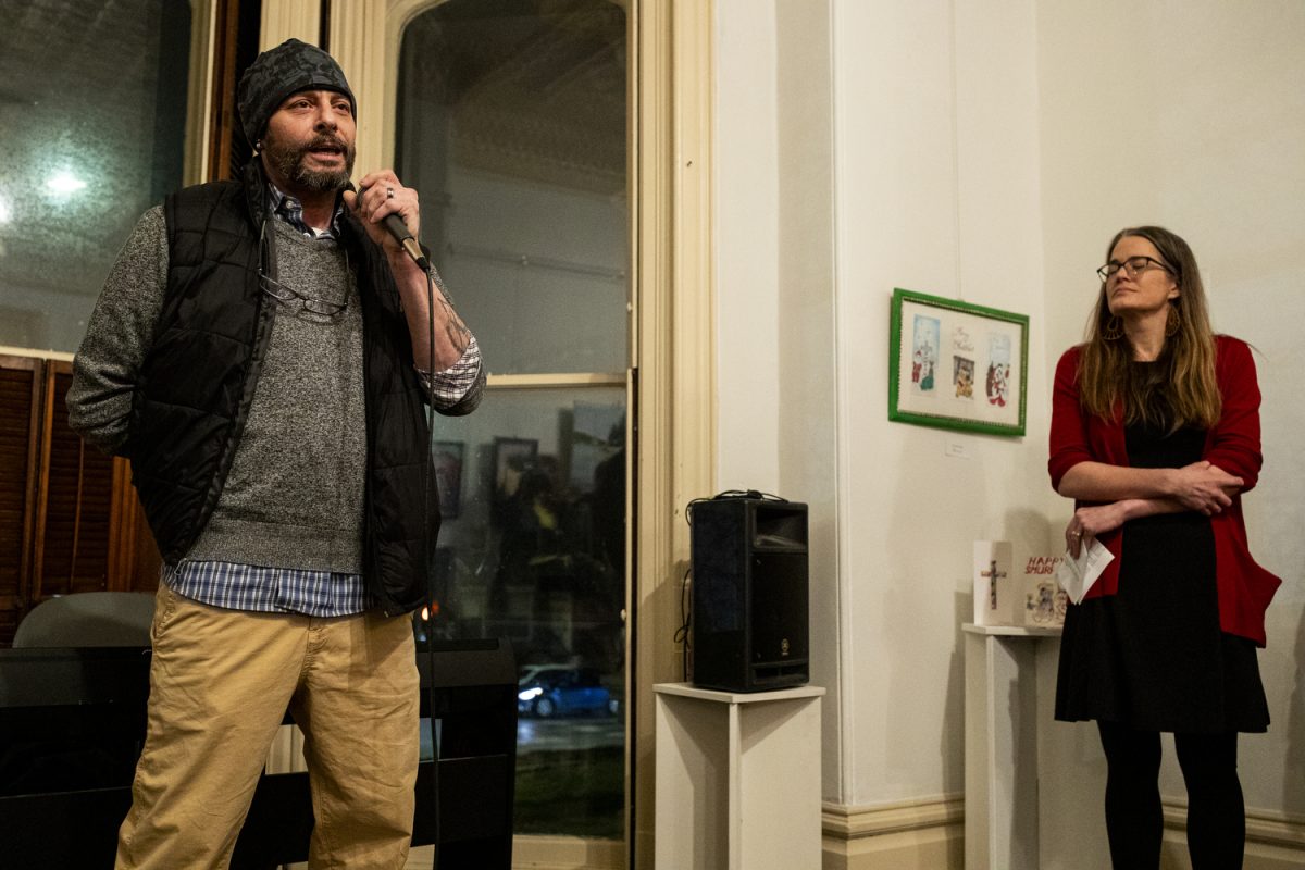 Shawn Lurkens speaks during a art gallery opening for formally incarcerated artists hosted by Inside Out Reentry at Public Space One in Iowa City on Friday, Feb. 2, 2024. My artwork is not free until I am, said Lurkens. 