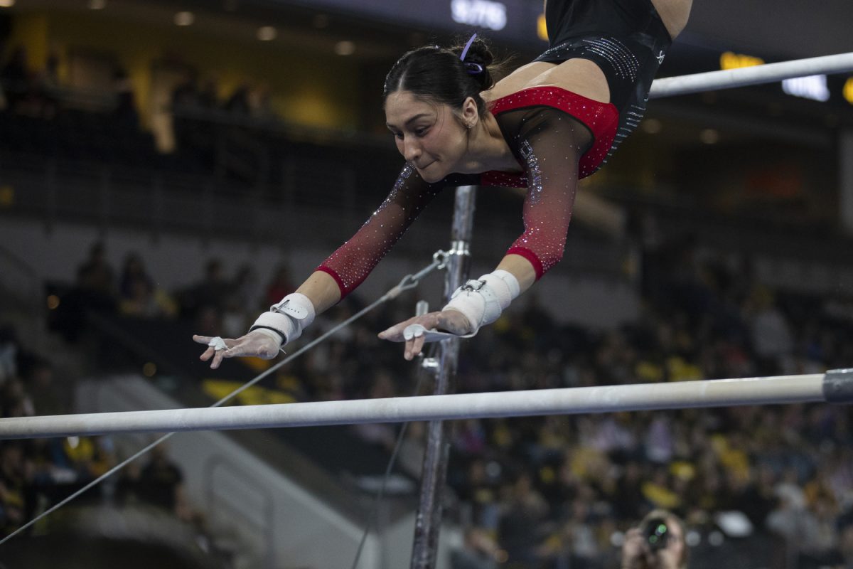 Nebraska gymnast Csenge Bácskay competes on bar during a gymnastics meet between No. 27. University of Iowa and No. 26 University of Nebraska at Xtream Arena on Sunday, Feb. 4, 2024. The Cornhuskers defeated the Hawkeyes, 196.5- 195.725. Bácskay scored 9.725 in the event, placing 9th. 