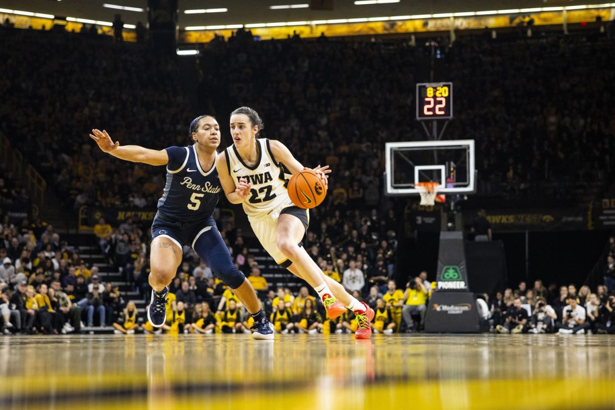 Iowa guard Caitlin Clark dribbles the ball during a basketball game between No. 2 Iowa and Penn State at Carver-Hawkeye Arena in Iowa City on Thursday, Feb. 8, 2024. The Hawkeyes defeated the Lady Lions, 111-93.
