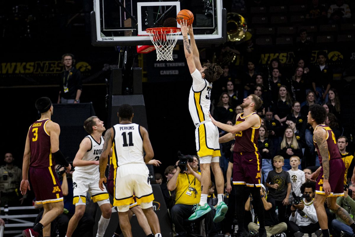 Iowa forward Owen Freeman jumps for a dunk during a men’s basketball game between Minnesota and Iowa at Carver-Hawkeye Arena on Sunday, Feb. 11, 2024. The Hawkeyes defeated the Gophers 90-85. Freeman had 17 points and 14 rebounds during the game. 

