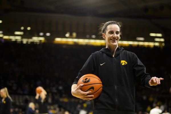 Iowa guard Caitlin Clark warms up before a women’s basketball game between No. 4 Iowa and Michigan at Carver-Hawkeye Arena on Thursday, Feb. 11, 2024.
