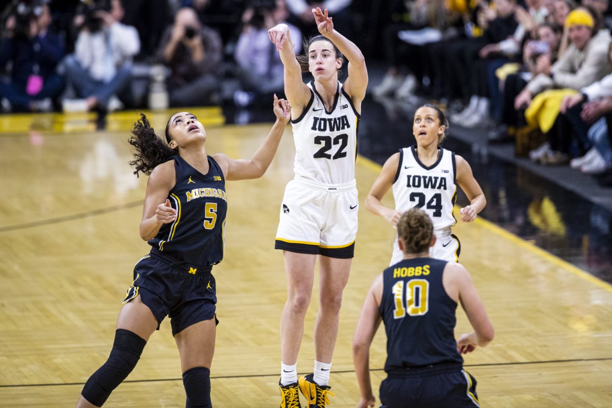 Iowa guard Caitlin Clark shoots the record-breaking shot during a women’s basketball game between No. 2 Iowa and Michigan at Carver-Hawkeye Arena on Thursday, Feb. 15, 2024.
