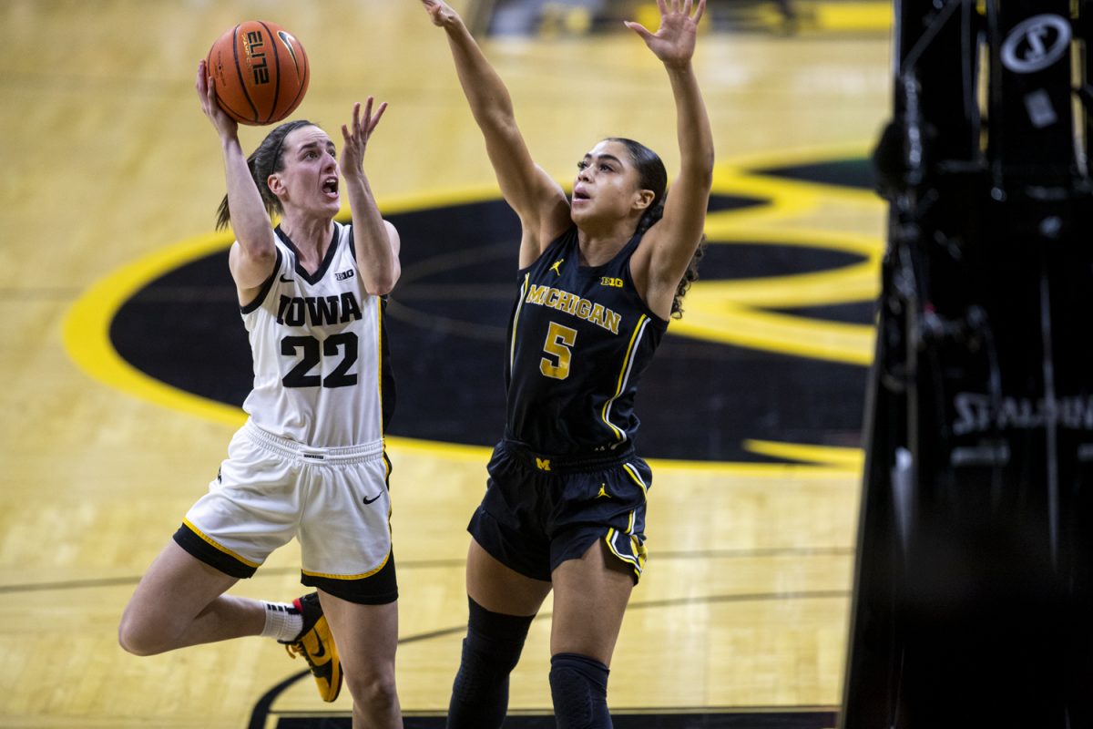 Iowa guard Caitlin Clark shoots the first shot of the game during a women’s basketball game between No. 4 Iowa and Michigan at Carver-Hawkeye Arena on Thursday, Feb. 11, 2024.