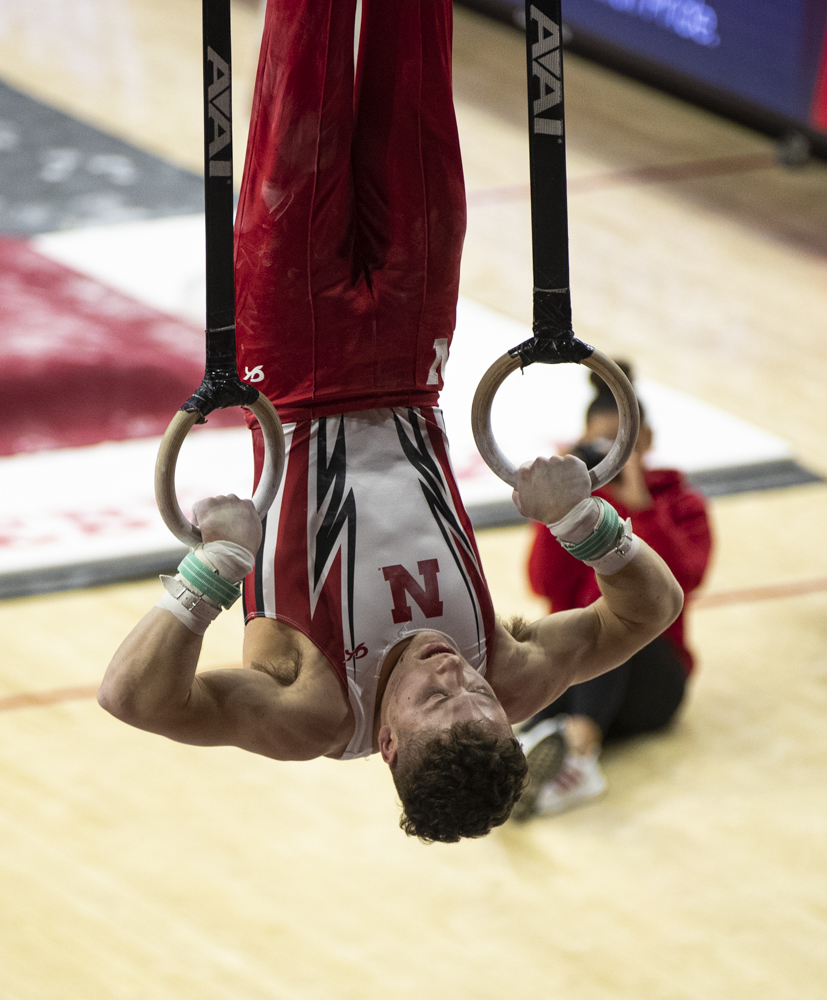 Nebraska gymnastic James Friedman begins flips on the still rings during a men’s gymnastics meet between Nebraska, Greenville, and Army in Bob Devaney Sports Center in Lincoln, Nebraska on Saturday, Feb.17, 2024. The Nebraska Cornhuskers won the meet with a score of 412.90. Friedman scored 13.100 and placed second on the still rings. (Carly Schrum/The Daily Iowan)