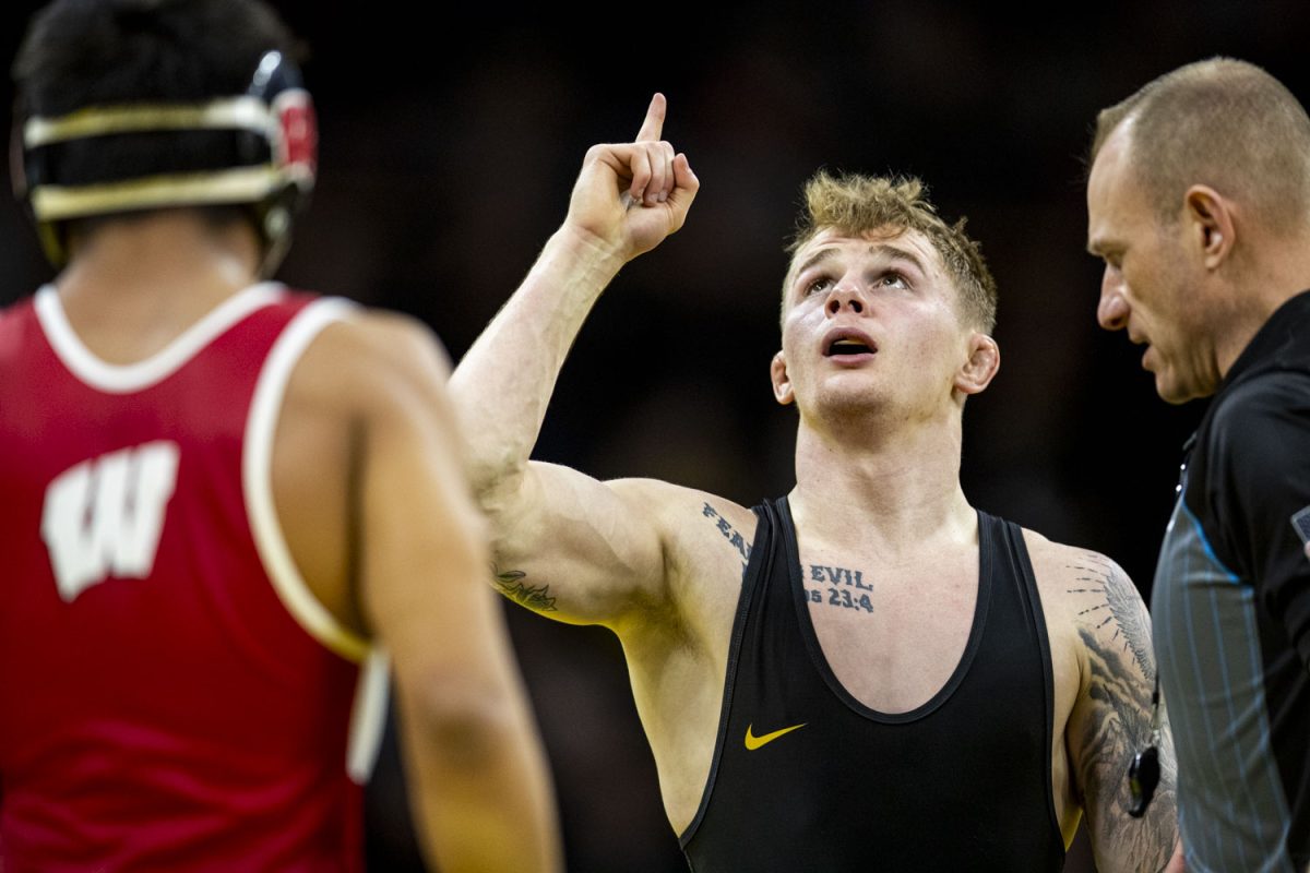 Iowa 133-pound Brody Teske gestures after defeating Wisconsin Nicolar Rivera during a men’s wrestling dual between No. 4 Iowa and Wisconsin at Carver-Hawkeye Arena on Sunday, Feb. 18, 2024. The Hawkeyes defeated the Badgers, 34-7. (Cody Blissett/ The Daily Iowan)