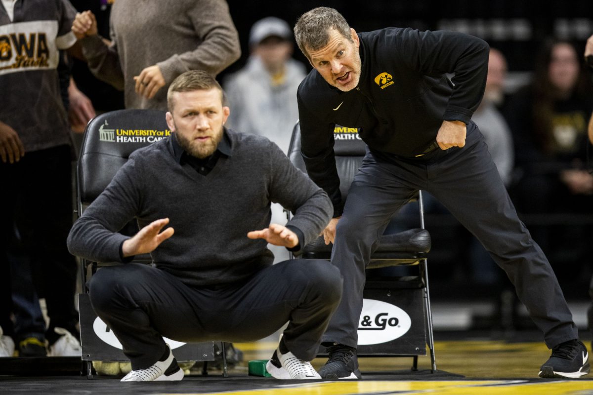Iowa head coach Tom Brands observes a men’s wrestling dual between No. 4 Iowa and Wisconsin at Carver-Hawkeye Arena on Sunday, Feb. 18, 2024. The Hawkeyes defeated the Badgers, 34-7.