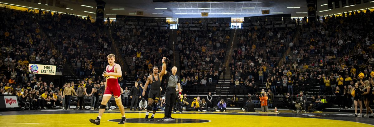 An official holds up Iowa 184-pound Gabe Arnold’s arm after defeating Wisconsin No. 16 Shane Lieg during a men’s wrestling dual between No. 4 Iowa and Wisconsin at Carver-Hawkeye Arena on Sunday, Feb. 18, 2024. Arnold won via decision 8-6. The Hawkeyes defeated the Badgers, 34-7.