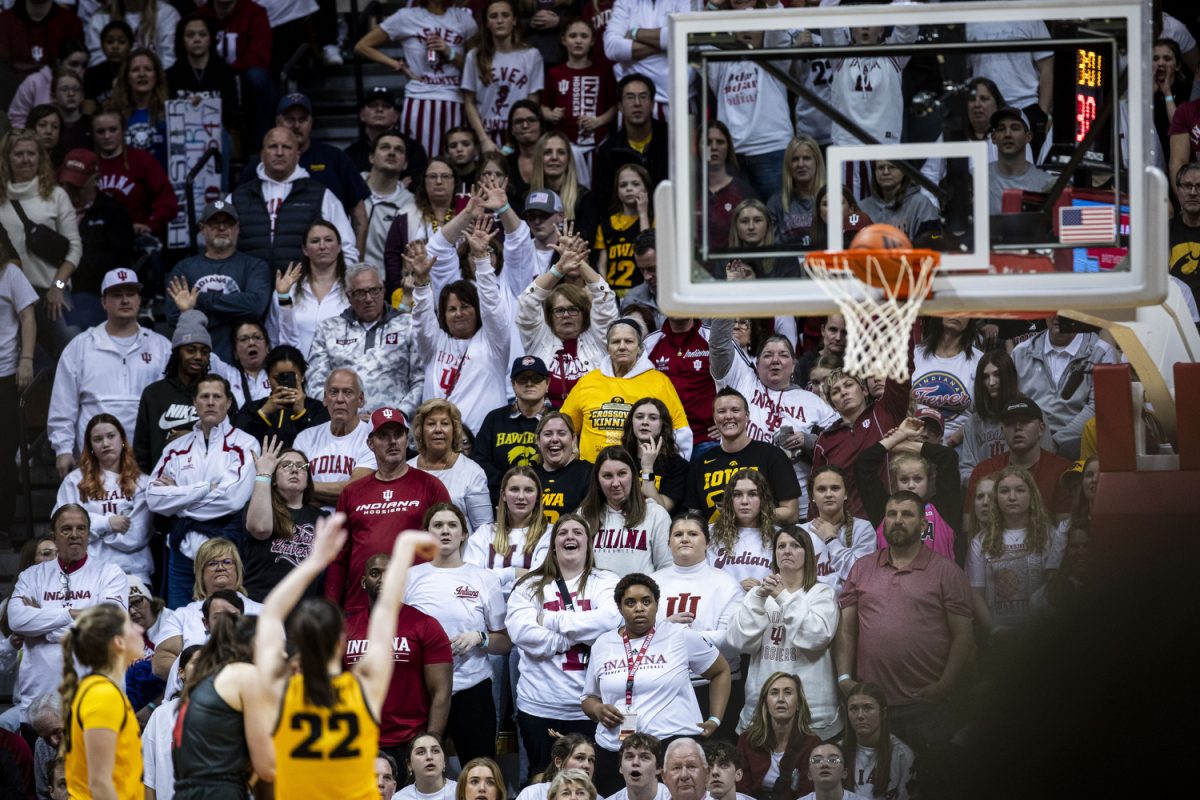 Fans watch Iowa guard Caitlin Clark shoot free throws during a women’s basketball game between No. 4 Iowa and No. 14 Indiana at Simon Skjodt Assembly Hall in Bloomington, Ind. on Thursday, Feb. 22, 2024. The Hoosiers lead the Hawkeyes, 44-33. (Cody Blissett/The Daily Iowan)
