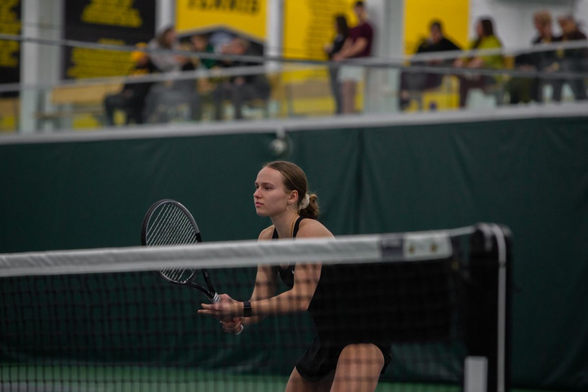 Iowa’s Pia Kranholdt awaits a serve during a tennis meet between Iowa and Oregon at the Hawkeye Tennis and Recreation Complex in Iowa City on Friday, Feb. 23, 2024. The Ducks defeated the Hawkeyes, 4-3.