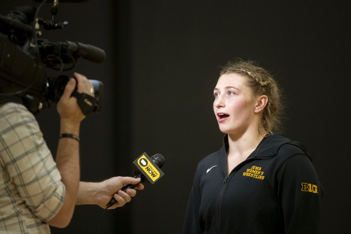 A member of the media interviews the Iowa’s 170-pound Kylie Welker after the NCWWC Regionals at Cowles Fieldhouse in Indianola, Iowa, on Friday, Feb. 23, 2024.