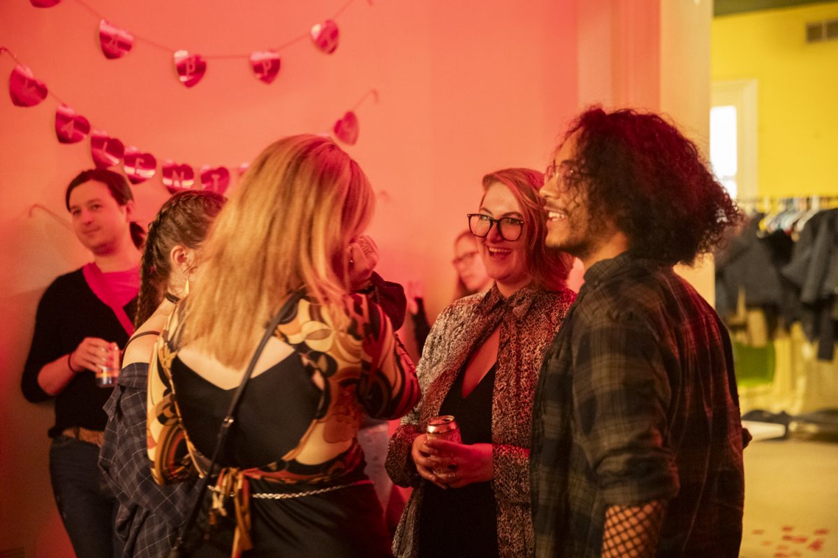 Eventgoers mingle during the Big Queer Dating Show at Public Space One on Saturday, Feb. 24th, 2024, in Iowa City. (Ava Neumaier/The Daily Iowan)