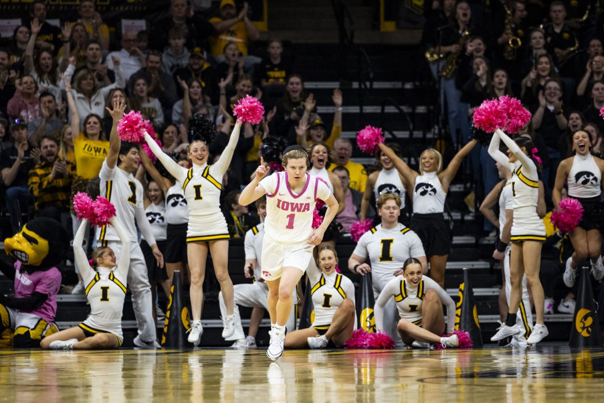 Iowa fans cheer after Iowa guard Molly Davis scores during a basketball game between No. 4 Iowa and Illinois inside a sold-out Carver-Hawkeye Arena in Iowa City, Iowa, on Sunday, Feb. 25, 2024. 