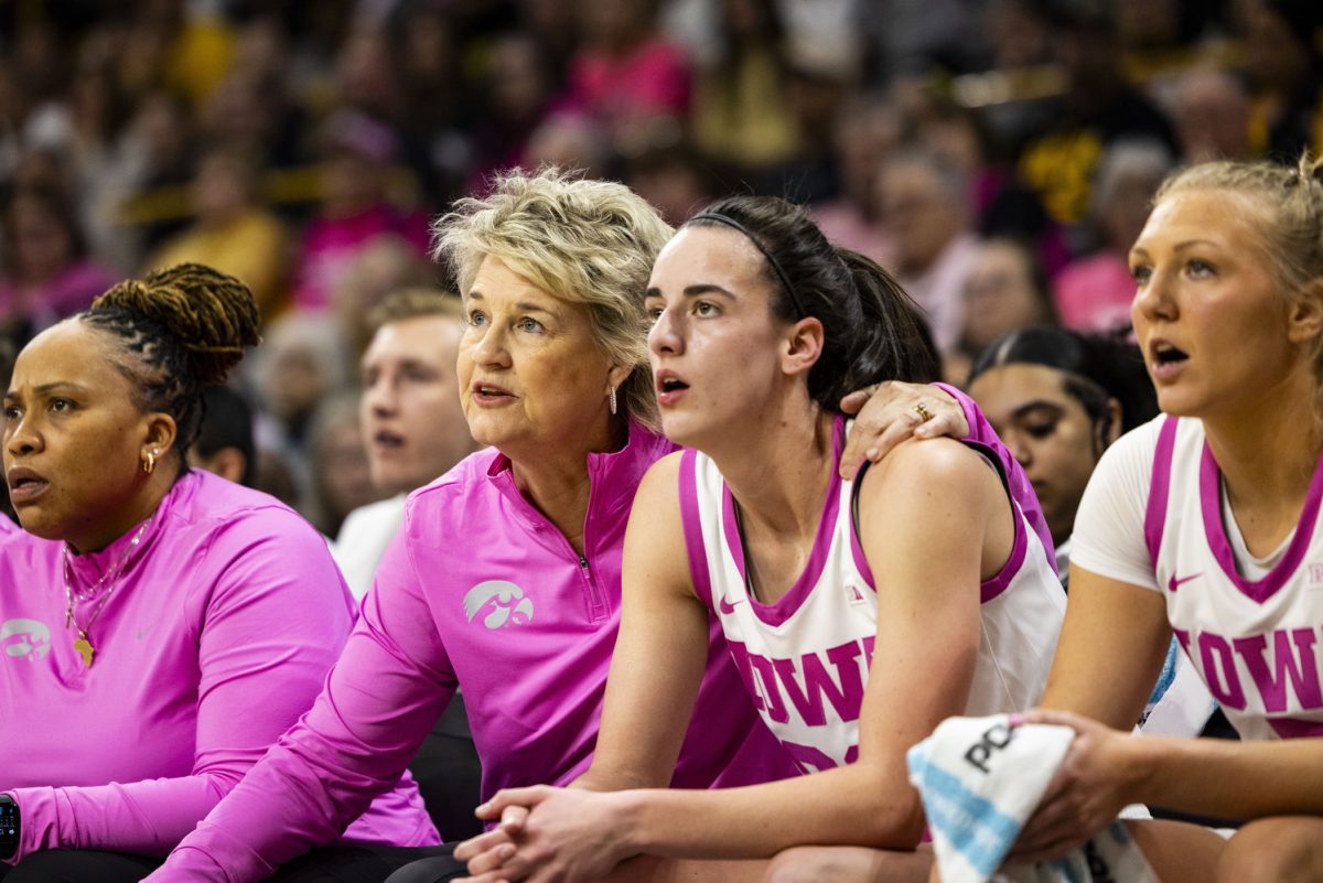 Iowa head coach Lisa Bluder comforts Iowa guard Caitlin Clark during a basketball game between No. 4 Iowa and Illinois inside a sold-out Carver-Hawkeye Arena in Iowa City, Iowa, on Sunday, Feb. 25, 2024. The Hawkeyes defeated the Fighting Illini, 101-85.