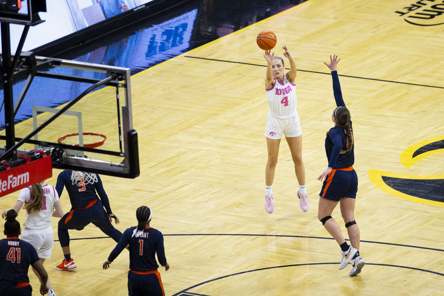 Iowa guard Kylie Feuerbach shoots a 3-pointer during a basketball game between No. 4 Iowa and Illinois inside a sold-out Carver-Hawkeye Arena in Iowa City, Iowa, on Sunday, Feb. 25, 2024. Feuerbach scored three 3-pointers for Iowa in her 15 minutes and 57 seconds of playing time. The Hawkeyes defeated the Fighting Illini, 101-85. (Grace Smith/The Daily Iowan)